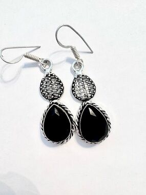 Beautiful, 2 inch, 925 marked, faceted, black Onyx earrings .